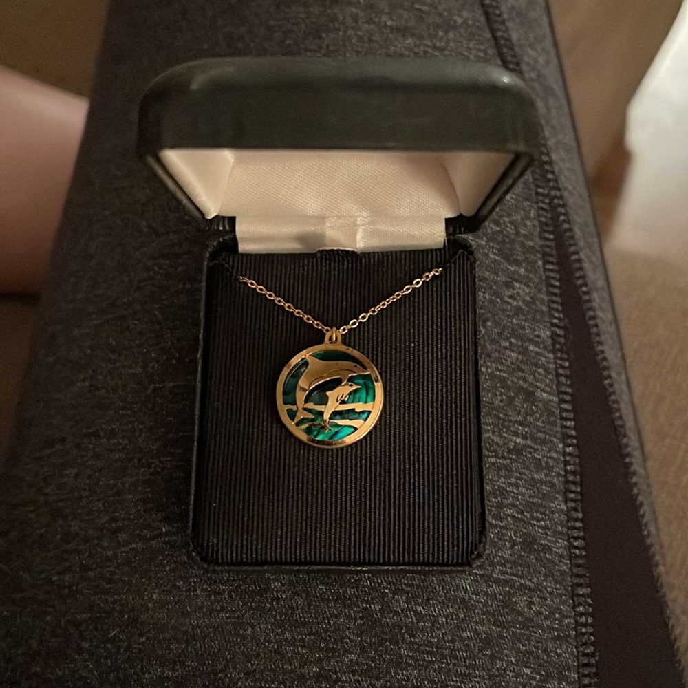 Dolphin necklace with green disc